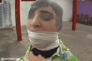 www.escapevideos.com - Charlotte Ball Gag Hood Fondle 2 thumbnail
